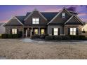 Charming home featuring stone accents, symmetrical design, and well-maintained landscaping at 37 Water Oak Dr, Sharpsburg, GA 30277