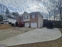 Spacious two-story home with a two-car garage and extended driveway, offering ample parking at 1101 Silver Moon Trl, Lithia Springs, GA 30122