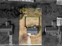 Aerial view of a property showcasing the layout of the house and the land around it at 141 Whistle Way, Locust Grove, GA 30248