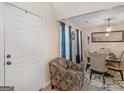 Inviting dining room with elegant table setting, chandelier, and natural light at 141 Whistle Way, Locust Grove, GA 30248