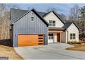 Stylish two-story home with a modern garage door and a meticulously landscaped yard at 859 N Bay Overlook, Villa Rica, GA 30180