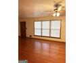 Spacious living room with hardwood floors and large windows offering ample natural light at 6576 Randall Mark Dr, Morrow, GA 30260