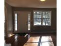 Inviting living room featuring hardwood floors, natural light, and a welcoming entrance at 47 Elm St, Hampton, GA 30228