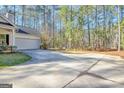 Long driveway and attached garage offer ample parking space at 186 Brogdon Rd, Fayetteville, GA 30214