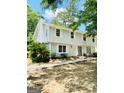 A well-maintained two-story home with white trim, showcasing its inviting facade at 1209 Willow Creek Nw Ct, Conyers, GA 30012