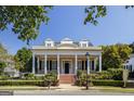 Charming home with a welcoming front porch, elegant columns, and manicured landscaping for great curb appeal at 3786 Turnberry Ct, Duluth, GA 30096