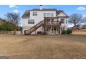 Expansive backyard featuring a multi-level deck and patio, perfect for outdoor entertaining at 120 Highland Park Dr, Sharpsburg, GA 30277