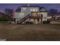 Expansive backyard featuring a multi-level deck and patio, perfect for outdoor entertaining at 120 Highland Park Dr, Sharpsburg, GA 30277