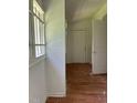 Bright hallway with multiple doorways and wood flooring at 2681 Oldknow Dr, Atlanta, GA 30318