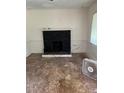 Living room featuring black fireplace and worn flooring at 2681 Oldknow Dr, Atlanta, GA 30318