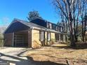 Attractive brick home with a convenient carport and a neatly maintained lawn and landscaping at 6740 Davidson Ct, Lithonia, GA 30058