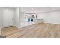 Open-concept living space with modern flooring and lots of natural light at 2544 Overlook Dr, East Point, GA 30344