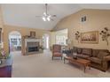 View of the living room, fireplace, and vaulted ceilings at 509 Carleton Pl, Locust Grove, GA 30248