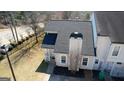 An aerial view shows the roof and a chimney, complemented by neat front yard landscaping at 6365 Wellington Walk Way, Lithonia, GA 30058