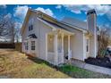 Inviting home showcases a front porch, bay window, and well-kept lawn with beautiful sky at 6365 Wellington Walk Way, Lithonia, GA 30058