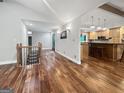 Open floor plan with hardwood floors, staircase and access to kitchen at 102 Pinegate Rd, Peachtree City, GA 30269