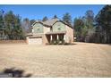 Charming two-story home featuring brick accents and a spacious front lawn at 276 Arborview Dr, Mcdonough, GA 30252