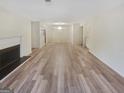 Spacious open-concept layout showcasing hardwood floors, fireplace, and bright lighting at 2725 St Augustine Trl, Marietta, GA 30067