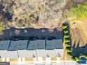 Overhead view of townhome roofs and surrounding trees at 3232 Tarian Way, Decatur, GA 30034