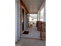 Covered front porch with stylish stone work, offering a welcoming entrance at 5790 Ridge Stone Way, Cumming, GA 30041