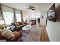 Bright living room featuring modern furniture, wood floors, and open floor plan at 2508 Sylvan Rd, East Point, GA 30344