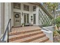 Inviting front entrance featuring a wreath, sidelights, and brick steps at 375 Darren Dr, Fayetteville, GA 30215