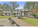 A beautifully landscaped home with a brick walkway leading to the front entrance at 375 Darren Dr, Fayetteville, GA 30215