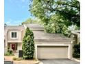 Charming townhouse with attached garage, featuring a well-maintained exterior and inviting front entrance at 3192 Paces Mill Se Rd, Atlanta, GA 30339