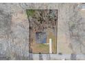 Aerial view of property lines showcasing the home, the yard and surrounding trees at 505 Phillips Dr, Palmetto, GA 30268