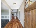 Inviting foyer with hardwood floors and view of the living area with fireplace at 603 Honey Creek Rd, Mcdonough, GA 30252