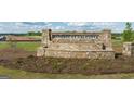 Community sign for Reserve at Calcutta with stone pillars and landscaping at 552 Whitman Lane # 2014, Stockbridge, GA 30281