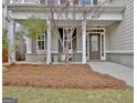 Inviting front porch with cozy seating, decorative accents, and a stylish front door at 722 Gittings Ave, Peachtree City, GA 30269