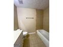 Bathroom featuring a shower-tub combo, nice vanity and tiled floors at 3756 Bright Star Rd, Douglasville, GA 30135