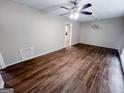 Spacious living room with hardwood floors, a ceiling fan, and natural light at 3401 Longleaf Dr, Decatur, GA 30032