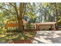 Beautiful brick home featuring a covered carport and well-maintained lawn at 1387 John Robert Dr, Morrow, GA 30260