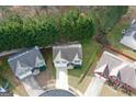 Aerial view of a well-maintained home with lush greenery and neighboring houses at 704 Davenport Ct, Stockbridge, GA 30281