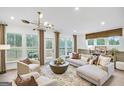 Open concept living room featuring neutral tones, hardwood floors and access to backyard at 5769 Tillman Way, Powder Springs, GA 30127