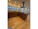 Beautiful eat-in kitchen featuring a large island, gas range, and stainless steel hood at 2577 Headland Dr, East Point, GA 30344