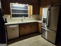 Traditional kitchen design, showcasing updated stainless steel appliances and wood cabinetry at 5535 Beaver Sw Dr, Mableton, GA 30126
