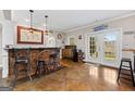 Wet bar area with counter seating and ample space for entertaining guests at 160 Allie Dr, Mcdonough, GA 30252