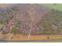 Aerial view of a wooded property, showcasing its expansive land and natural surroundings at 630 Stoney Point Rd, Bowdon, GA 30108