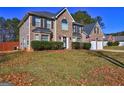 View of a beautiful two-story home with a well-manicured lawn and an attached garage at 346 Ermines Way, Mcdonough, GA 30253