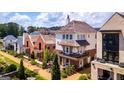 A high-angle view displays the beautiful architecture and landscaping of the homes at 135 Kelmscott Ln, Fayetteville, GA 30214