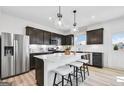 Modern kitchen with stainless steel appliances, white countertops, and a large center island at 120 Aj Welch Jr Way, Mcdonough, GA 30252