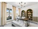 Bright office with stylish built-ins, desk, neutral palette, and abundant natural light at 120 Aj Welch Jr Way, Mcdonough, GA 30252