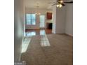 Spacious living room filled with sunlight, featuring plush carpeting and dining area at 181 Linton Dr, Acworth, GA 30102