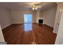 Spacious living room with hardwood floors, fireplace, and sliding glass doors at 3874 Austin Park Ne Ln, Decatur, GA 30032