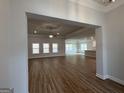 Open-concept living room with wood floors and ample natural light at 5311 Tuscany Dr # 98 Plapprox Sqft, Douglasville, GA 30135