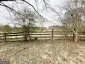 A rustic wooden fence runs along the back of the property at 3210 Rogers Rd, Mcdonough, GA 30252