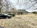 A single story home featuring a stone facade, covered porch, and a neatly landscaped front yard at 3210 Rogers Rd, Mcdonough, GA 30252